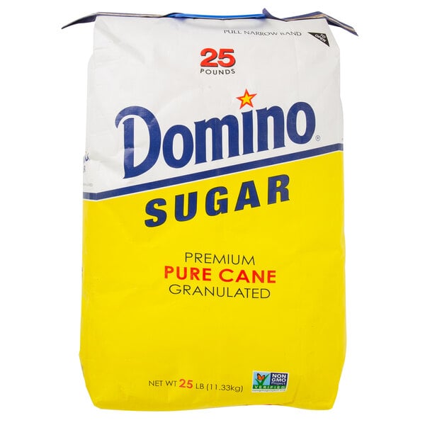 A white and yellow bag of Domino Pure Cane Granulated Sugar.