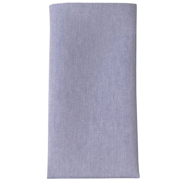A close up of a blue chambray cloth napkin.