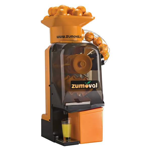 A Zumoval Minimatic orange juicer with oranges in the feeder.