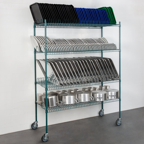 A Regency green wire drying rack with casters, 4 shelves, and metal posts holding plates and pans.