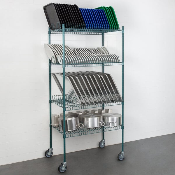 A Regency green wire shelving rack with 4 shelves holding plates and pans.