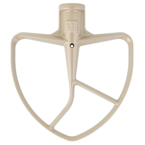 A beige KitchenAid mixer flat beater attachment with a white square on it.