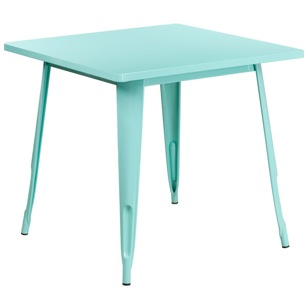 A Flash Furniture green mint metal square cafe table with legs.