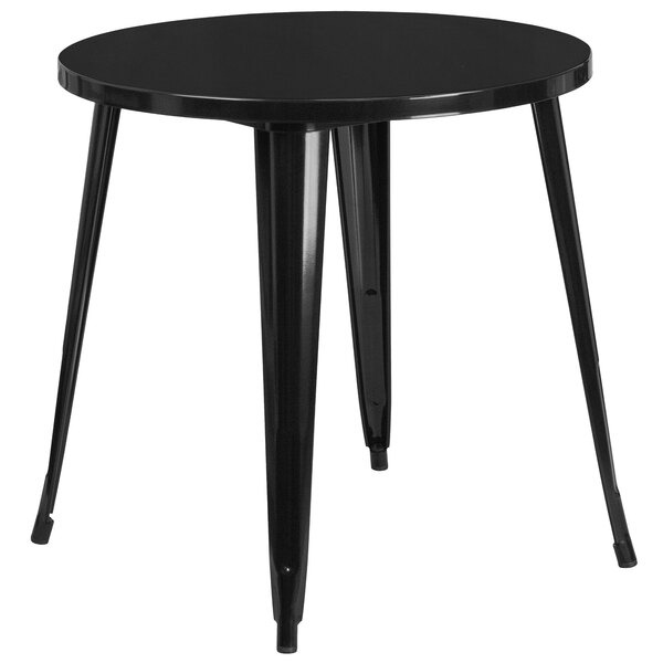 A black round Flash Furniture metal cafe table with legs.