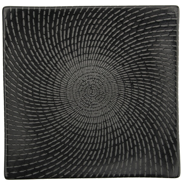 A black square Oneida Urban porcelain plate with a spiral pattern.
