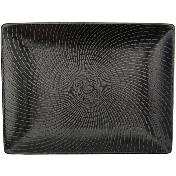 A black rectangular Oneida Urban porcelain sushi plate with a spiral design.