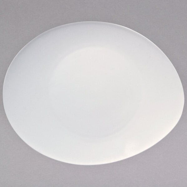 A warm white porcelain oval platter with a circular rim.
