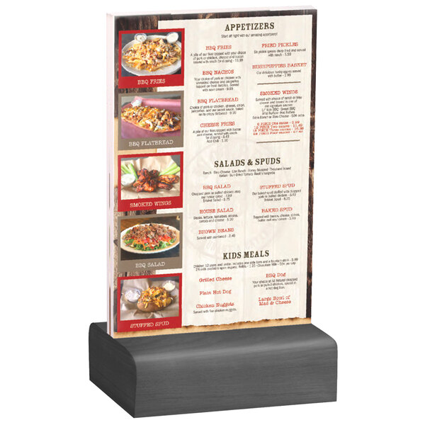 A Menu Solutions clear acrylic table tent with a solid ash wood base holding a menu on a table.