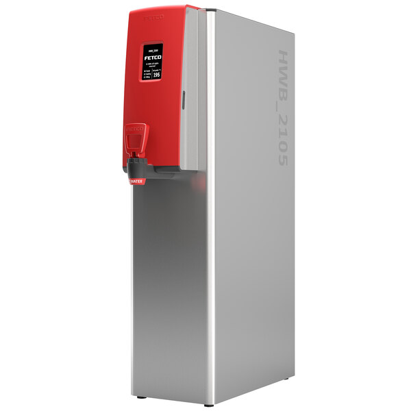 A Fetco stainless steel hot water dispenser with a red lid.