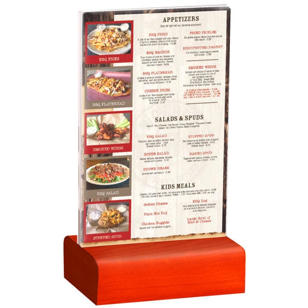 A Menu Solutions clear acrylic table tent with a solid berry wood base holding a menu on a table