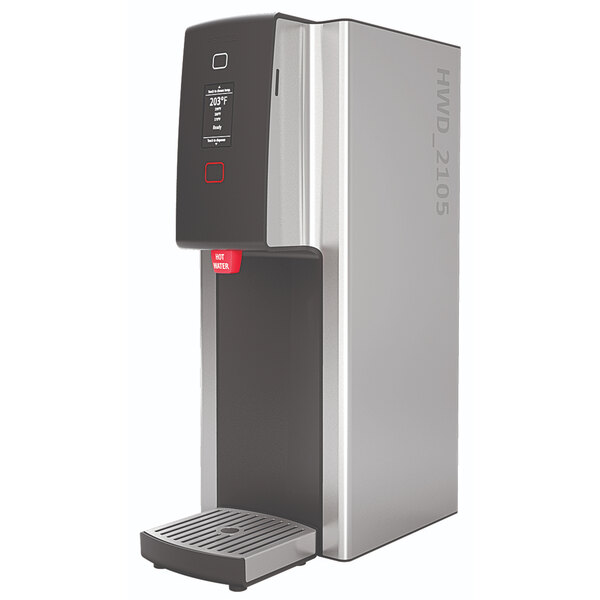 A stainless steel Fetco hot water dispenser with black and red buttons.