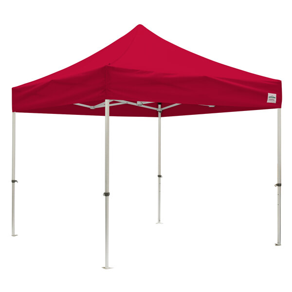 A red Caravan Canopy tent with white poles.