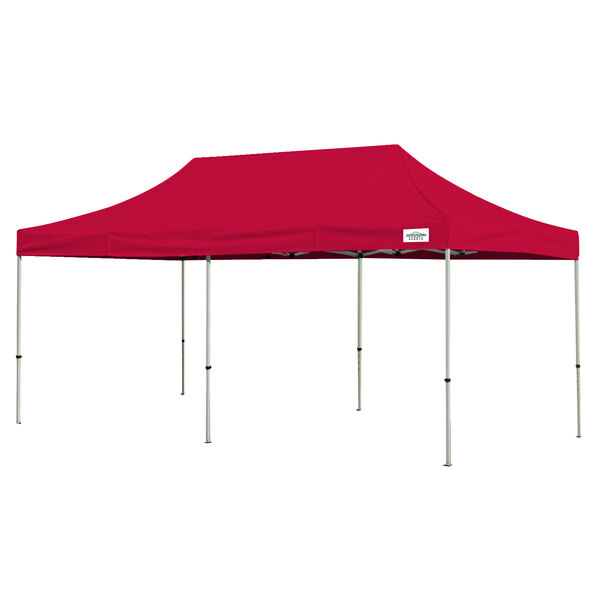 A red rectangular Caravan Canopy tent with white poles.