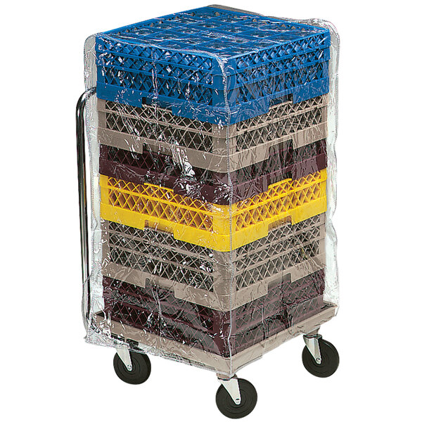 A white Vollrath Traex vinyl dust cover on a stack of plastic crates.