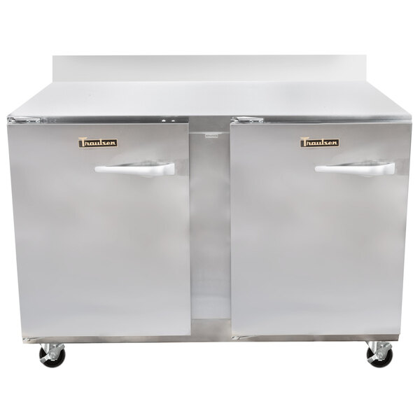 A stainless steel Traulsen worktop refrigerator with two doors and two drawers.