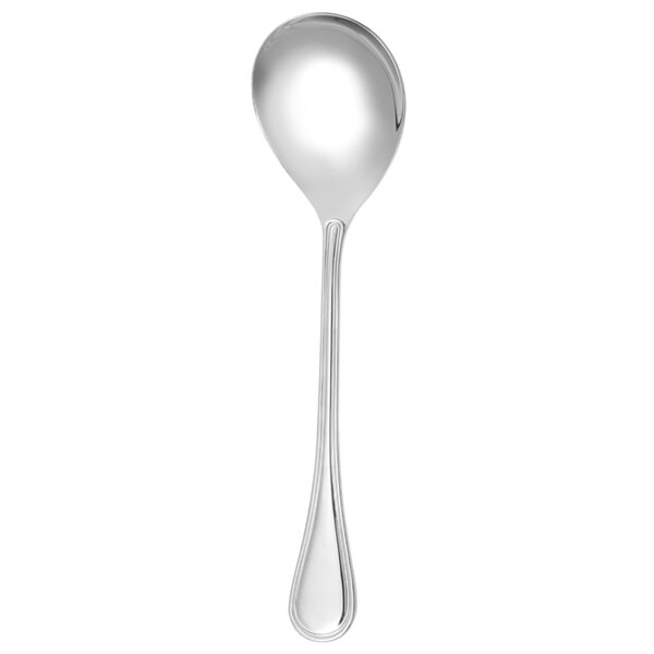 A close-up of a Walco Ultra stainless steel wide bottom spoon with a white background.