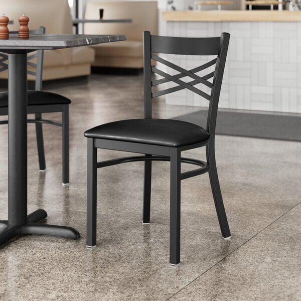 Lancaster Table & Seating Black Finish Cross Back Chair with 2 1/2" Black Vinyl Padded Seat