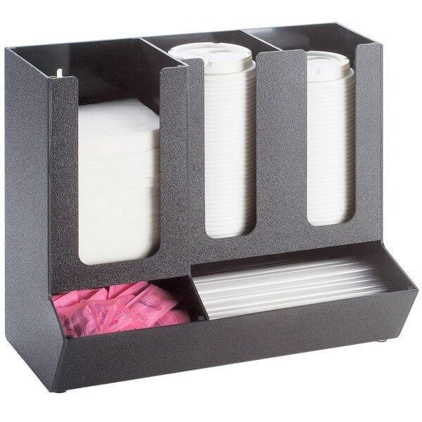 A black Cal-Mil countertop organizer with straw and condiment compartments holding white cups.