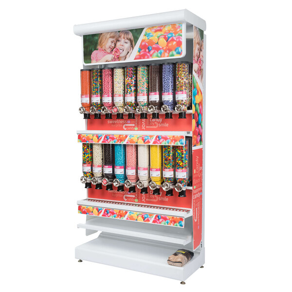 A white display of Rosseto candy dispensers filled with many different types of candy.