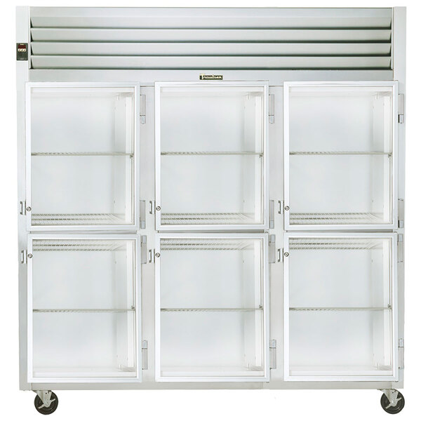 A white Traulsen reach-in refrigerator with three glass doors and metal shelves.