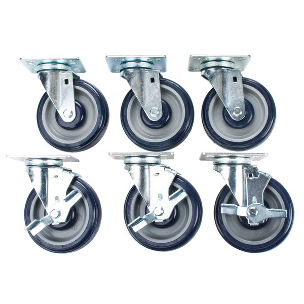 A group of Cooking Performance Group 5 inch casters with black rubber wheels.