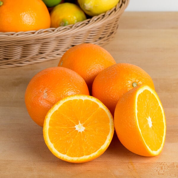A case of fresh oranges on a white background.