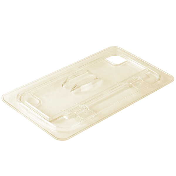 A clear plastic lid with a handle for a white curved countertop container.