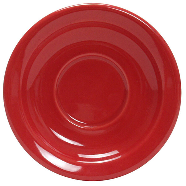 A white Tuxton china saucer with a red rim and circle.