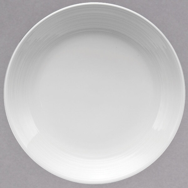 A white porcelain coupe plate with a white rim.