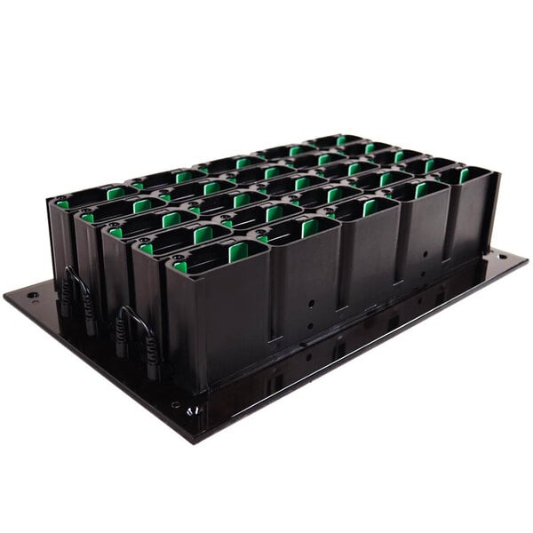 A black rectangular tray with green and black inserts.