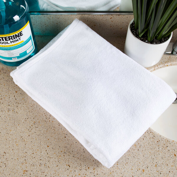 A white Oxford Platinum pool towel on a counter.