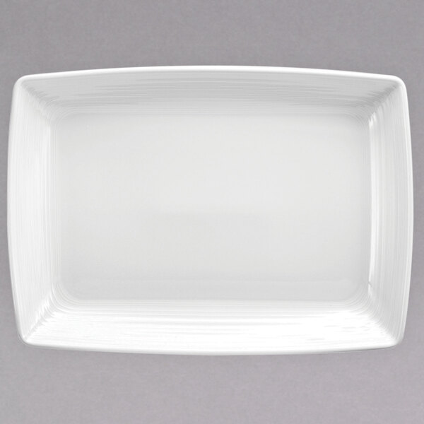 A white rectangular porcelain platter with a white rim.