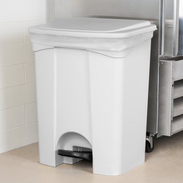 A white Lavex rectangular step-on trash can with a lid.