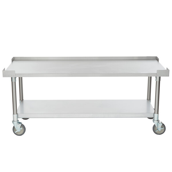 An APW Wyott stainless steel equipment stand with casters and a shelf.