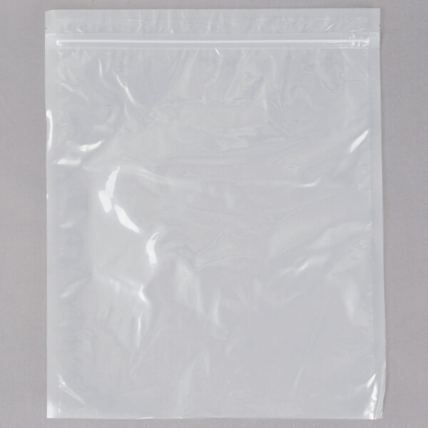 A clear plastic bag with a zipper on a white surface