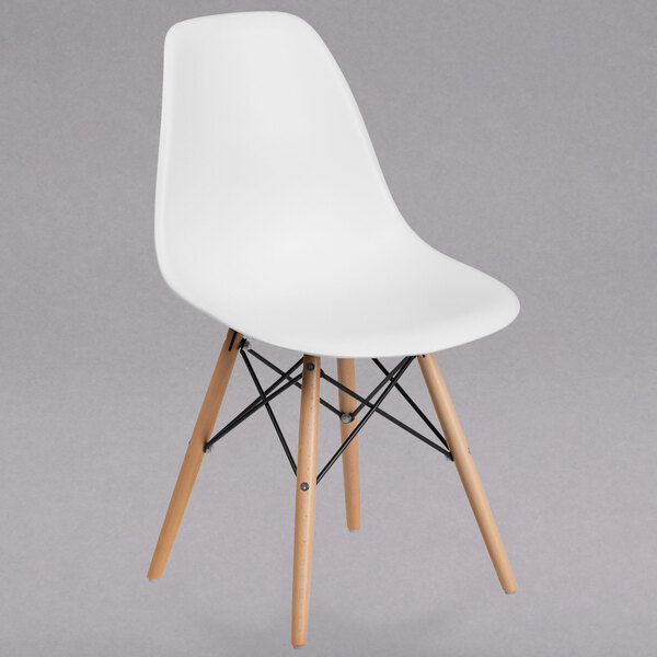 A white Flash Furniture plastic chair with wooden legs.