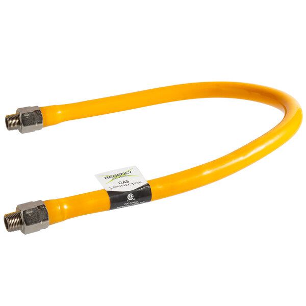 A yellow flexible Regency gas connector hose with silver metal fittings.