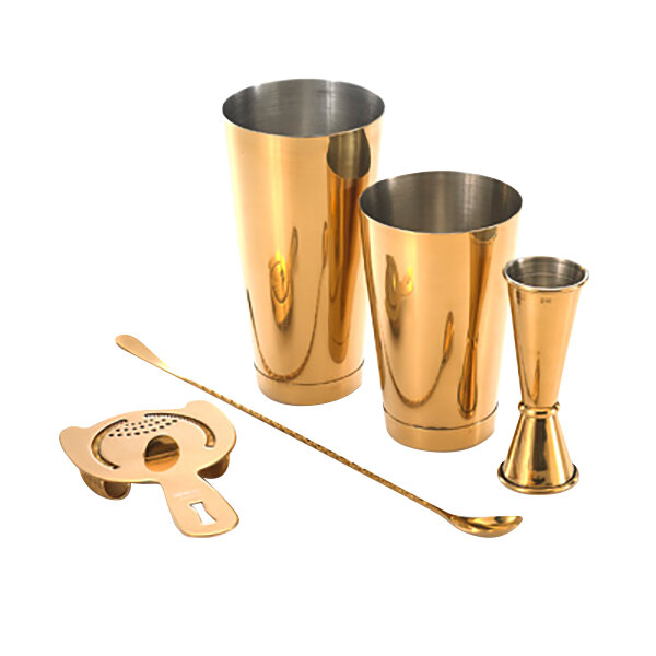 A gold-plated Barfly cocktail shaker set with a spoon.