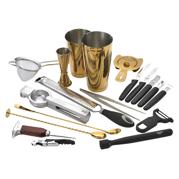 A Barfly gold-plated cocktail kit on a counter.
