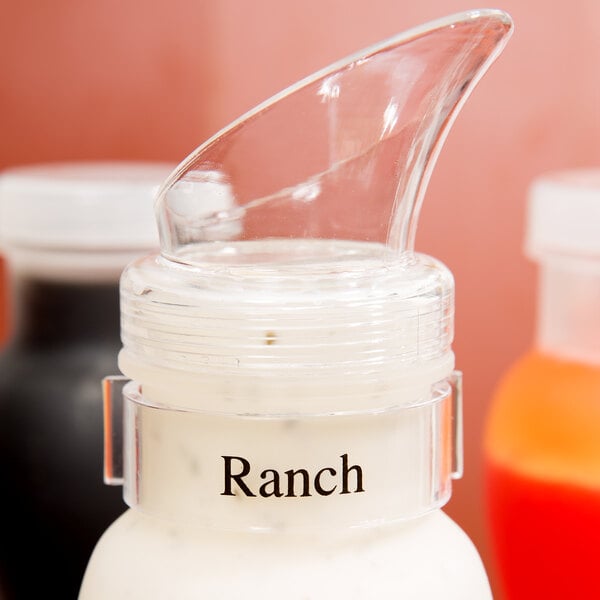GET CLIPS-8-CL Salad Dressing Label Clips on a plastic container of ranch dressing with a clear lid.