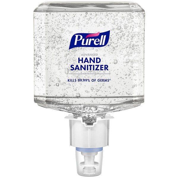 A Purell hand sanitizer dispenser on a wall.