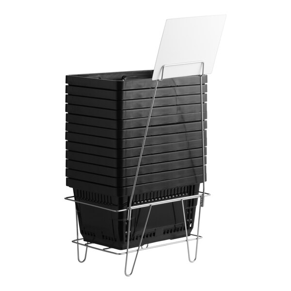 A set of black plastic grocery market shopping baskets stacked on a metal stand with an attached sign holder.