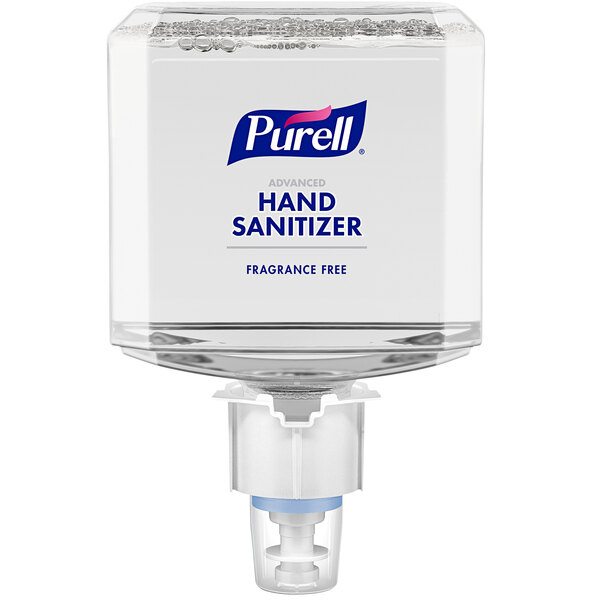 A Purell ES4 hand sanitizer dispenser with clear containers and bubbles on top.