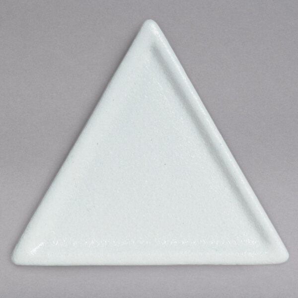 A white triangle shaped plate with a smooth finish.