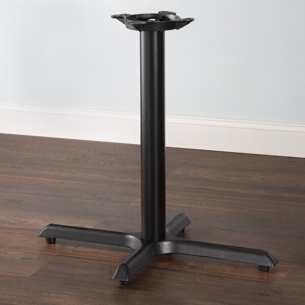 A Lancaster Table & Seating black cast iron table base with a pedestal column.