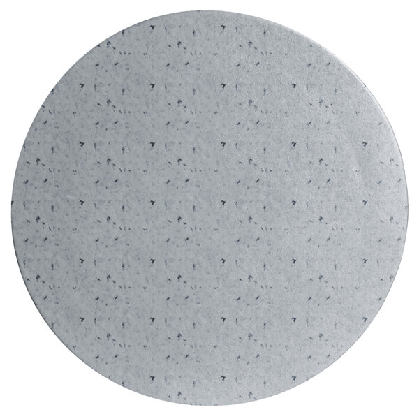 A white round metal disc with a grey granite texture and black specks.