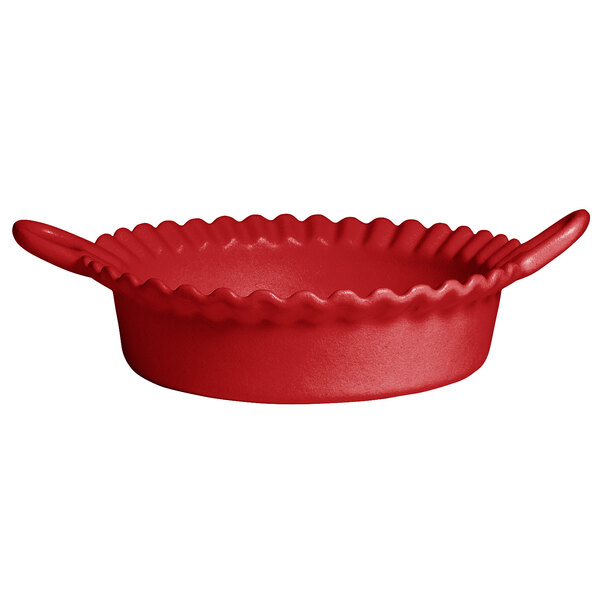 A cranberry red resin-coated aluminum deep Mexican cazuela with handles.