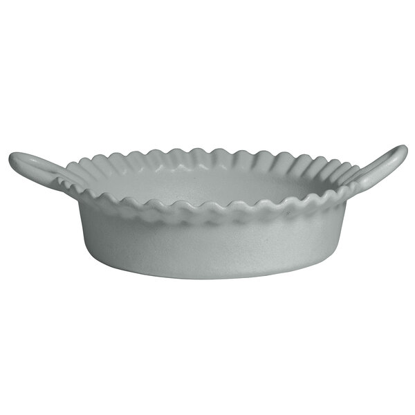 A white G.E.T. Enterprises steel resin-coated aluminum bowl with a wavy edge and handles.