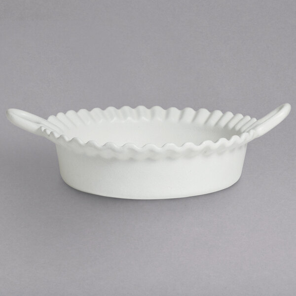 A white bowl with a wavy edge.