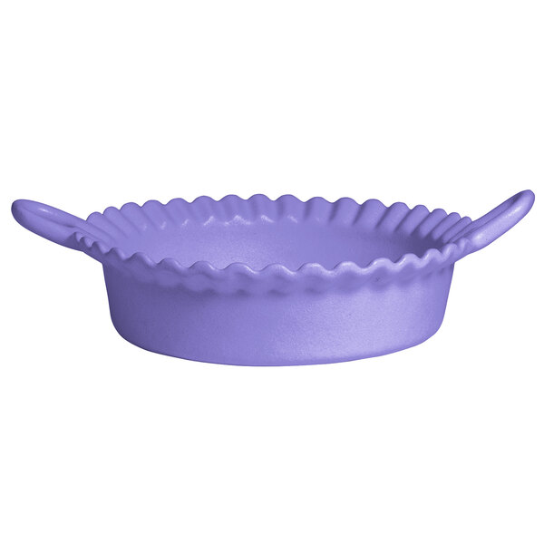 A lavender resin-coated aluminum deep Mexican cazuela with a smooth finish and wavy edge.